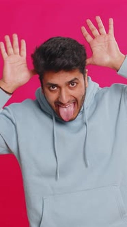 Man Posing and Making Silly Faces in Studio