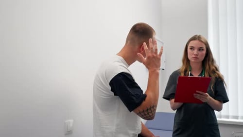 in a Modern Clinic in a Small Therapist s Office a Young Girl Doctor with a Stethoscope is Examining