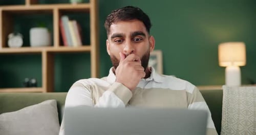 Laptop, man and celebration on couch for online trading with stock market profit