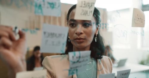 Woman Planning Strategy in Modern Office