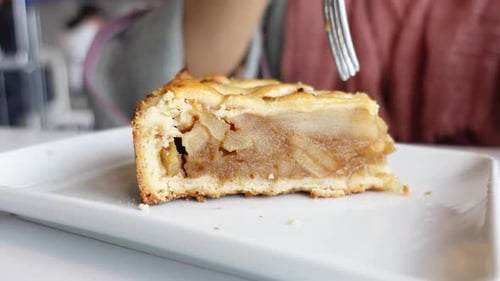 Woman Eats Delicious Slice of Fresh Apple Pie