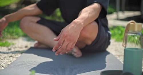 Hands Closeup Young African American Spirituality Man Meditating Yoga Asana Sitting in a Park