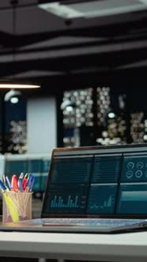 Vertical Video Luxurious Modern Office Space with Important Reports on Laptop