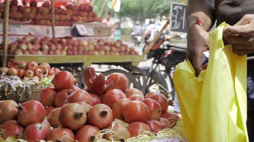 Pomegranates for Sale on a Street Cart