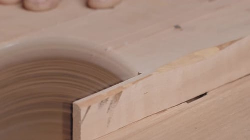 A Man Carpenter Uses Circular Saw As Cutting Tool for Trimming Wooden Planks The Milling of Board