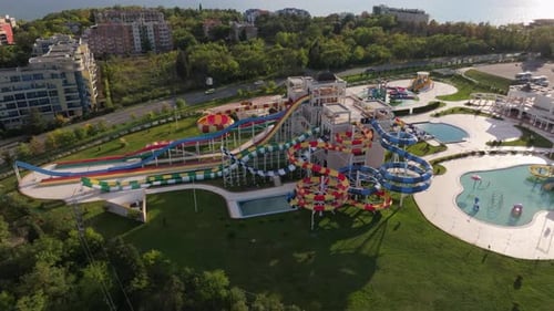 Aerial view of colorful aquapark with water slide and hotel, Pomorie, Bulgaria.