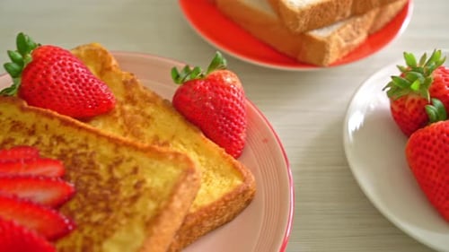 french toast with fresh strawberry on plate
