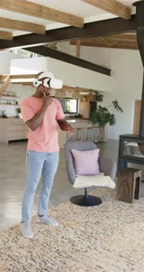 Man Using Virtual Reality Headset at Home