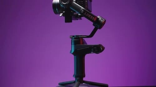 Camera Mounted on Rotating Motorized Gimbal Stabilizer