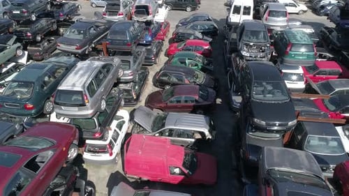 Aerial view of a junkyard and large group of wrecked cars