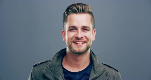 Smiling Man Makes Heart Shape With Hands