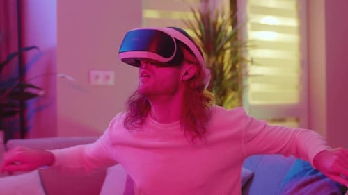 Adult Wearing VR Headset Interacting with Virtual Environment