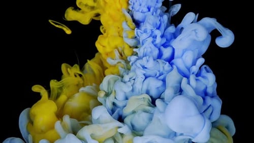 Abstract Yellow and Blue Ink Flowing Underwater