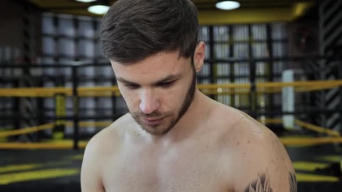 Intense Boxer Prepares to Fight in the Ring