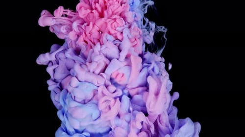 Colorful Paint Swirling in Water on Black Background