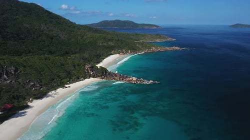 Aerial views over the white sandy beaches on La Digue Island in the Seychelles, Africa.