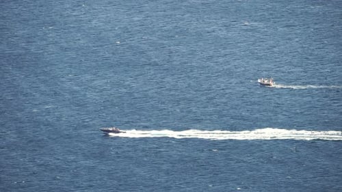High Speed Water Bike Leaving Abstract White Footprints on the Sea Water