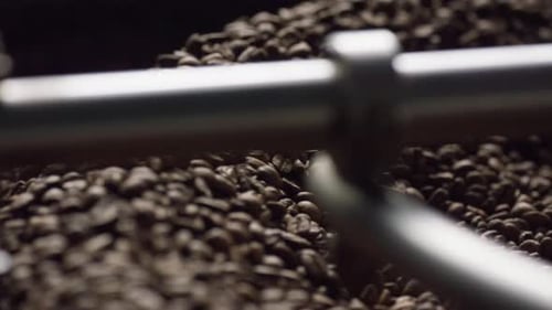 Coffee beans rotating in a roasting machine