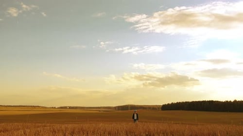 Walk on Martian Land Teen Boy Walks on a Field in Sunny Weather Morning Walk Against the Backdrop of