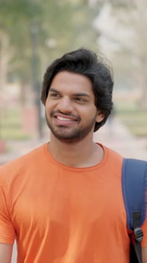Vertical Video of Young Indian Man Walking