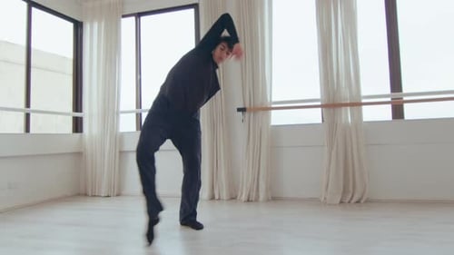 Young Male Dancer Practicing Modern Dance during Studio Rehearsal