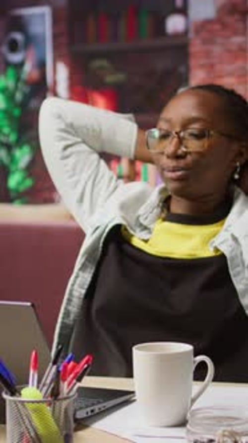 Vertical Video Happy Woman Drinking Coffee Enjoying Watching TV Show During Relaxation Time
