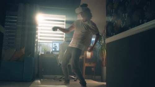 Teenager Playing Video Game in VR Headset