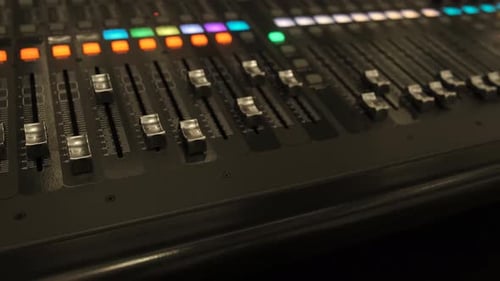 Working on a large sound mixer