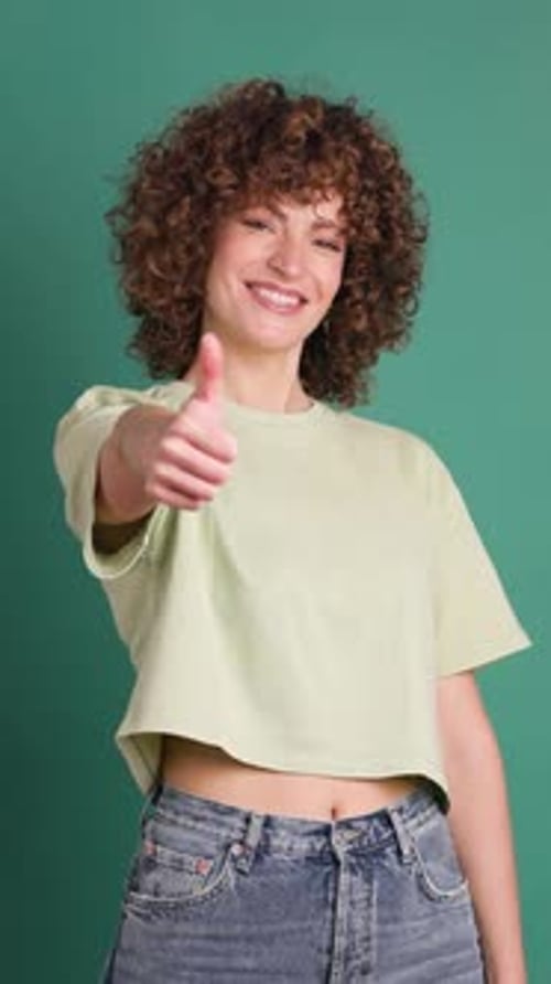 Adult Woman on Studio Giving a Thumbs Up Gesture Vertical Orientation