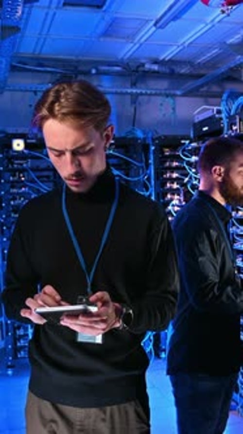 Young Men Working With Servers