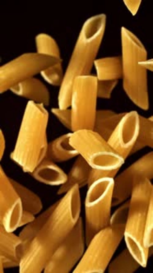 Super Slow Motion Flying Dry Penne Pasta Filmed on a Highspeed Camera at 1000 Fps