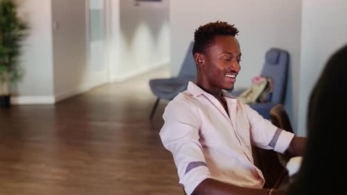 Young business people talk strategy over coffee at an office meeting
