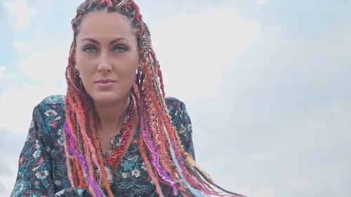 Woman with Colorful Braids and Hoop Earrings