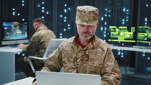 Bearded Army Officer in Camouflage Uniform Performing Secret Data Center Security Operations