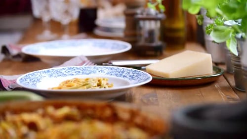 Serving Delicious Pasta Dish at Family Dinner Table