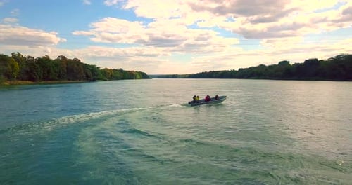 Boat Cruising Down Tropical River, Aerial View