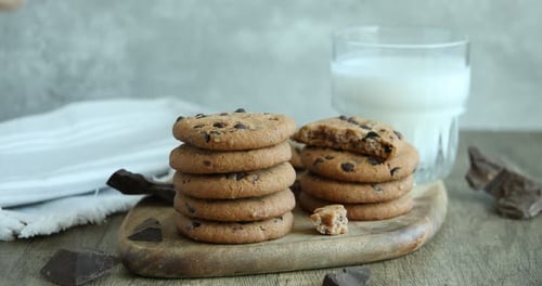 Delicious Chocolate Chip Cookies Stacked with Glass of Milk