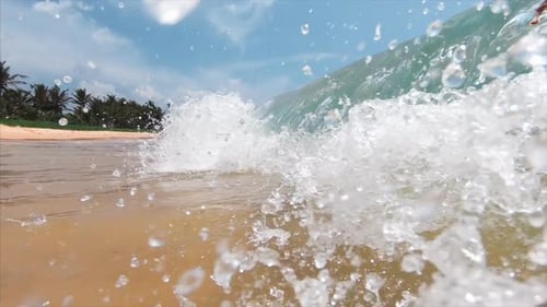 Beautiful Waves Crashing onto Tropical Sandy Beach