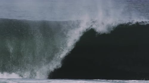 Wave Collapses With Force Sending Spray Outward, Close-Up Slow Motion