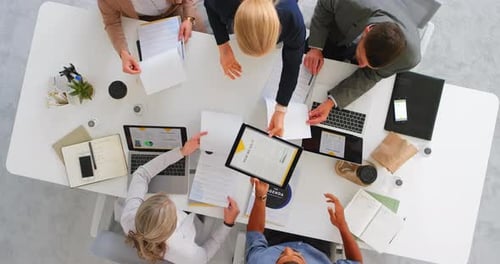 Top view, brainstorming and team in office, writing or online research for planning