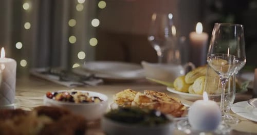 A Woman Puts a Festive Turkey on the Table