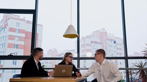 Business Meeting at Modern Office with City View