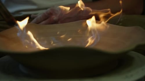 Chef Torching a Glazed Dish with Culinary Torch