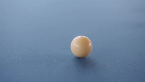 Cue Ball Slowly Rolling On The Pool Table