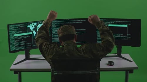 Asian Man Soldier Celebrating And Dancing While Write Code With Multiple Screens In Green Screen