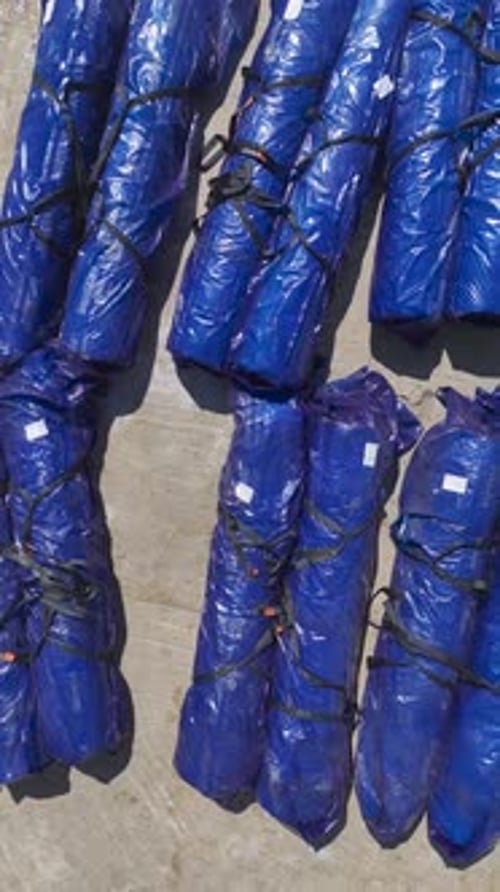 Bundles in Blue Plastic from Birds Eye View