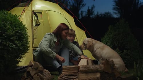 Mom and Son Trying to Start a Fire Sitting in Tent Family Camping Vacation