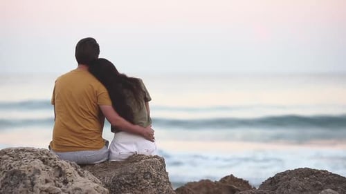 Young Couple in Love on the Beach Summer Vacation at Sunset