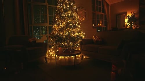 Glowing Christmas Tree in Dark Cozy Home Interior
