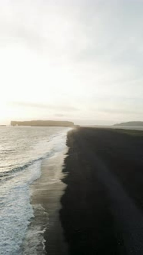 Aerial view of black sand beach in Iceland in winter.